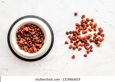 Dry Cat Food In Bowl On White Stone Backgorund Top View Copy Space