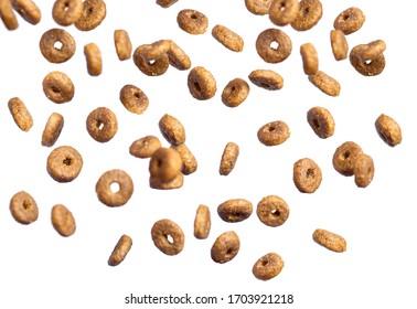 Dry Cat Food Poured In Different Directions On A White Background. Flying.