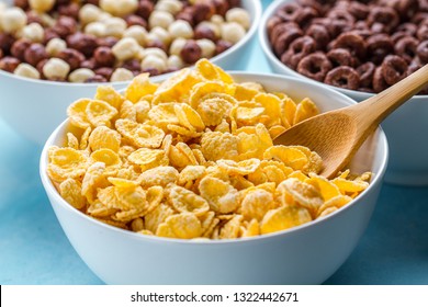 Dry, Cereals Breakfast. Spoon And Bowl With Frosted Yellow Corn Flakes 