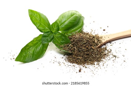 Dry Chopped Basil In Wooden Spoon And Fresh Basil Green Leaves Isolated On White  