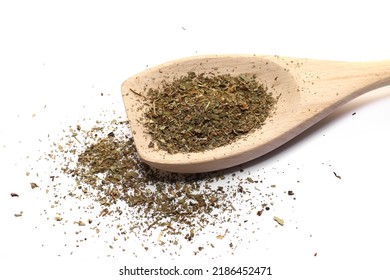 Dry Chopped Basil In Wooden Spoon Isolated On White  