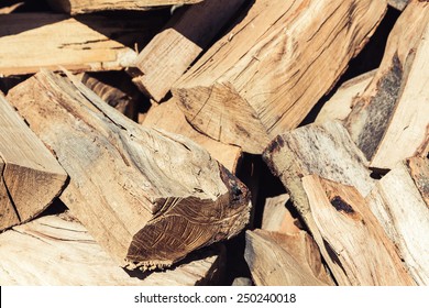 Dry chopped firewood logs in a pile 