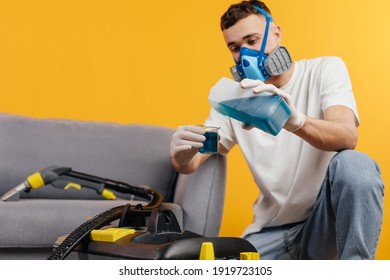 Dry Cleaner's Employee, Wearing Mask And Start Removing Dirt From Furniture In Flat. Professional Cleaning Company.