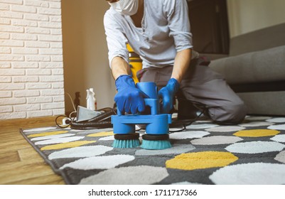 Dry Cleaner's Man Employee Removing Dirt From Carpet, Vacuum Clean With Professional Equipment.