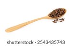 Dry clove buds in wooden spoon on white background. Aromatic spice