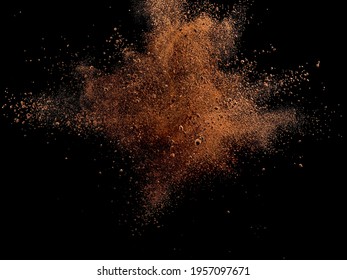 Dry cocoa powder explosion, close up