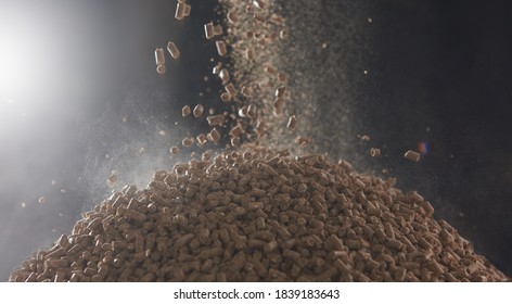 Dry Compressed Animal Feed Pellets Fall Into A Heap