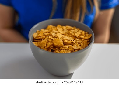 Dry cornflakes isolated in a bowl on the table - Powered by Shutterstock