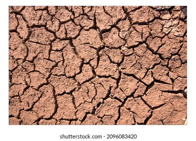 Dry Cracked Mud In A Summer Drought From Above Extreme Weather Concept