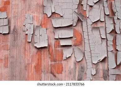 Dry Cracked Paint. Textured Background. Old Paint On The Door. Wooden Background In Cracked Paint.