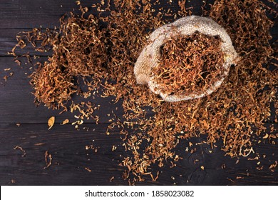 Dry Cut Tobacco Leaf On A Wooden Table