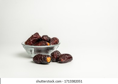Dry dates fruits isolated on white background. Favorite fruits by Muslim during fasting month of Ramadan.  - Shutterstock ID 1713382051
