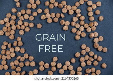 Dry Dog Food Against A Gray Background. Round-shaped Pellets. Grain-free Pet Food. Above Title In Capital Letters In The Center Of The Frame. Flatlay.