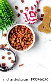 Dry Dog Food In Bowl On Stone Background Top View