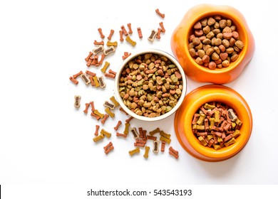 Dry Dog Food In Bowl On White Background Top View