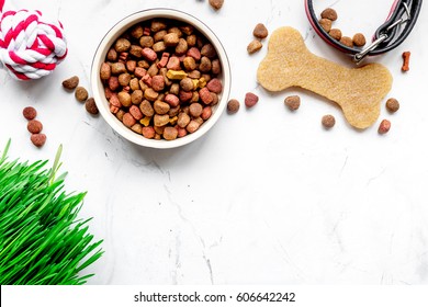 Dry Dog Food In Bowl On Stone Background Top View