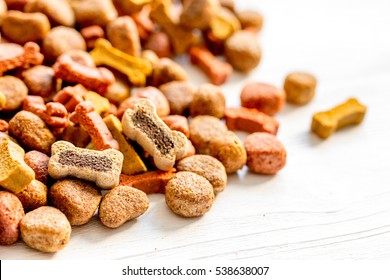 Dry Dog Food In Bulk On Wooden Background Close Up