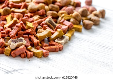 Dry Dog Food In Bulk On Wooden Background Close Up