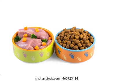 Dry Dog Food And Natural Dog Food In Colorful Ceramic Bowls Isolated On White 