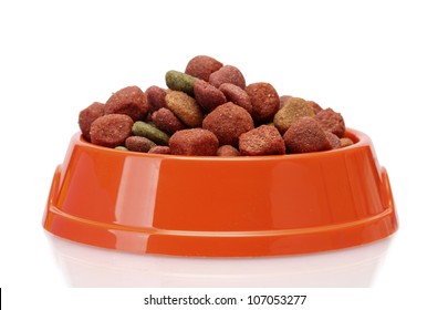 Dry Dog Food In Orange Bowl  Isolated On White