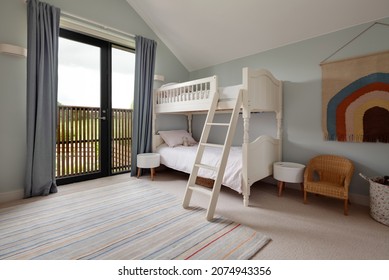 Dry Drayton, England - August 2 2019: Childs Bedroom Space With Bunkbed Including Ladder Decorated In Blue And White