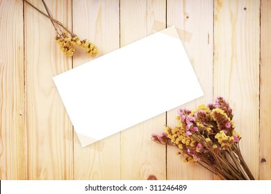 Dry Flowers With Blank Paper On Wood Texture