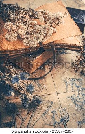 Dry flowers bouquets with old vintage diary and books, nostalgic vintage background