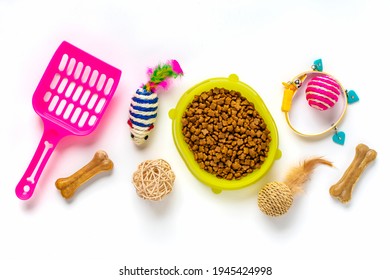 Dry Food In Bowl, Spatula, Nail Scissors, Collar, Balls, Bones Isolated On White Background Top View Flat Lay Toys, Accessories And Food For Your Beloved Pet Concept