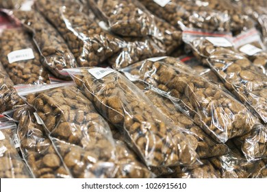 Dry Food In Individual Packaging In A Showcase At A Distribution In A Pet Store