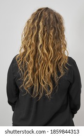 Dry And Frizzy Natural Curly Hair That Needs Hydration. Natural Curls Before Salon Treatment. Close Up, Soft Focus