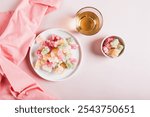 Dry frozen gummy bears candies on plate on table top view