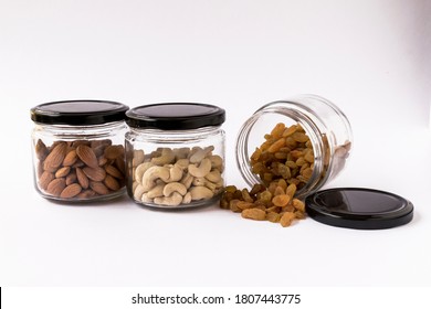 Dry Fruits And Nuts In Glass Jars, On White Background. Food Storage. Glass Containers. Kitchen Need.