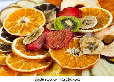 Dry Fruits Of Oranges, Bananas, Kiwi, Srtawberries, Apples And Peaches, Food For Vegetarians, Concept - Healthy Food Amd Snacks