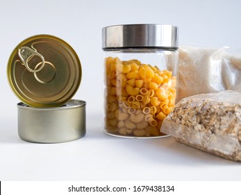 Dry goods, stockpiling, food supplies for staying home concept. Preserves, pasta, oatmeal, sugar on white background. - Shutterstock ID 1679438134