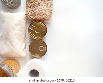 Dry goods, stockpiling, food supplies for staying home concept. Preserves, pasta, oatmeal, sugar, toilet paper on white background, copyspace, flat lay. - Shutterstock ID 1679438218