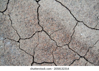 Dry Ground With Cracks. Texture With Cracks. Sand On The Beach