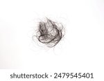 Dry Hairs falling on white background. Messy black long hair bunch falls on floor. Hair loss problem