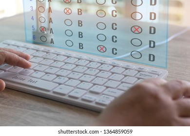 Dry Hand Of Adult Student Using White Keyboard On Table To Do Test Examination With Multiple Choice Questions On Virtual Screen At Home. Education Futuristic Technology And Lifelong Learning Concept.