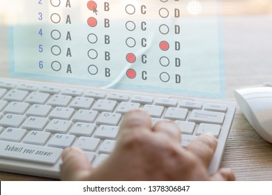 Dry Hand Of Adult Student Using White Keyboard On Table To Do Test Examination With Multiple Choice Questions On Virtual Screen At Home. Education Futuristic Technology And Lifelong Learning Concept.