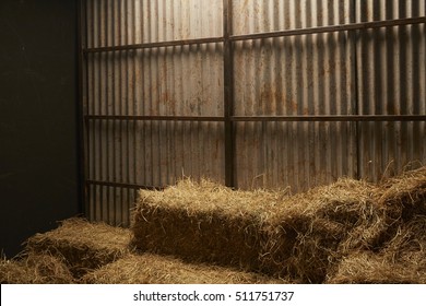 Dry hay stacks in wooden barn house interior