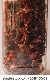 Dry hibiscus flower tea in a glass bottle - Flor de Jamaica