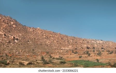 Dry hills and fields in the area of the Deccan plateau, India