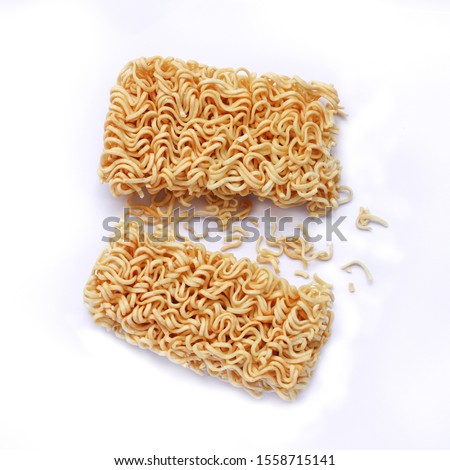 Dry instant noodles break on white background