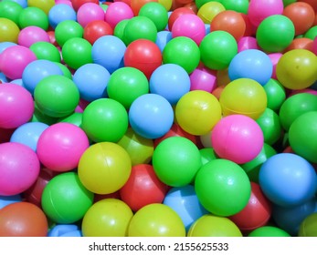 Dry Kids Pool With Colorful Plastic Balls. Pile Of Colorful Toy Balls For Kids In The Playground.