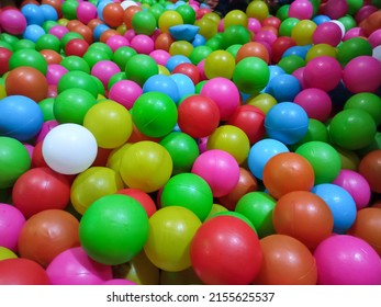 Dry Kids Pool With Colorful Plastic Balls. Pile Of Colorful Toy Balls For Kids In The Playground.