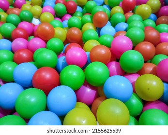 Dry Kids Pool With Colorful Plastic Balls. Pile Of Colorful Toy Balls For Kids In The Playground.