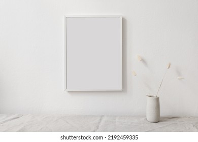 Dry Lagurus Grass, Plant Bouquet In Ceramic Vase. Table With Linen Tablecloth. Blank Vertical Picture Frame Mockup. White Wall Background. Empty Copy Space. Scandinavian Nterior. Autumn Still Life