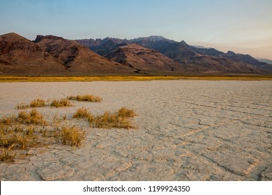 dry lake bed high desert alvord desert playa oregon pacific northwest with Steens mountain sunset
