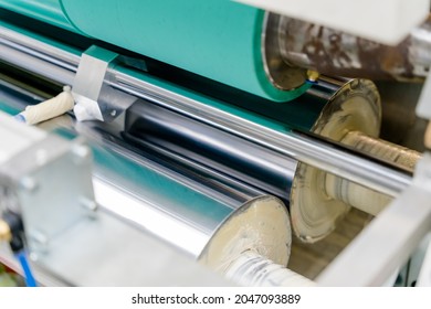 The Dry Lamination Machine Uses A Rubber Cylinder To Glue Adhesive To A Flexible Film. This Is One Of The Processes In The Packaging Business.