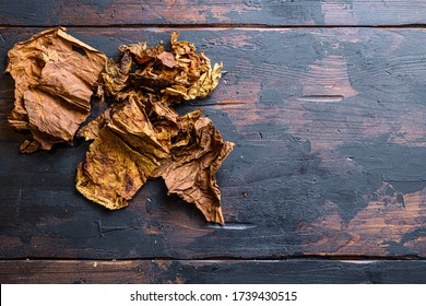 Dry Leafs Tobacco Nicotiana Tabacum And Tobacco Leaves On Old Wood Planks Table Dark Top View Space For Text